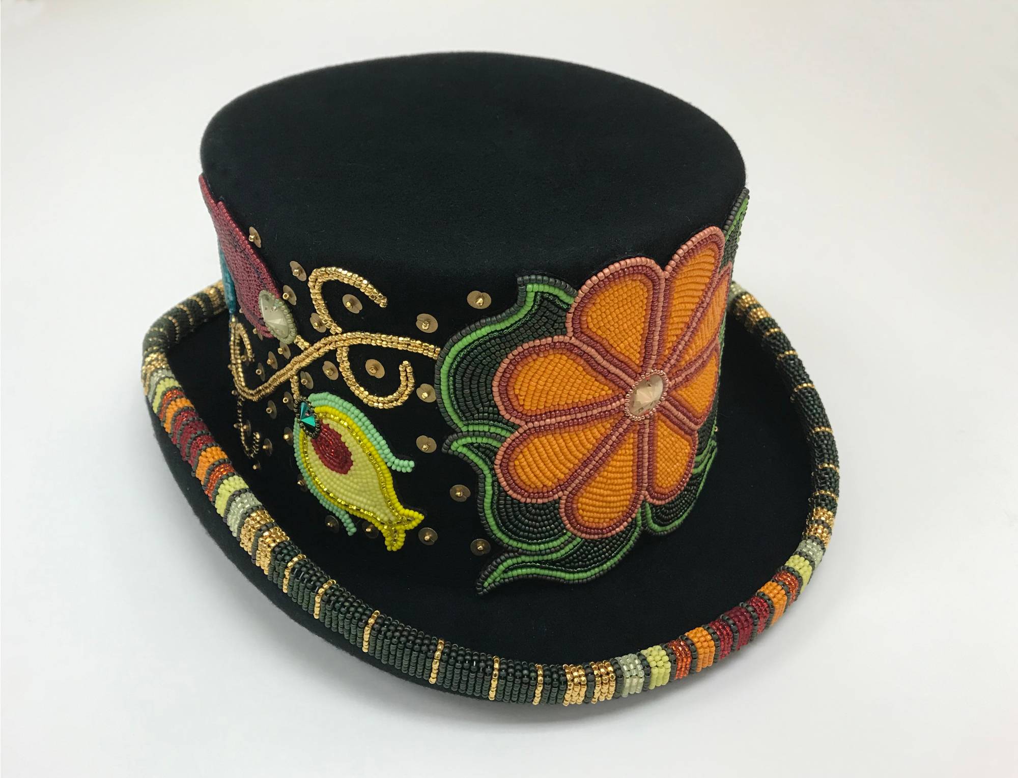 Black top hat decorated with colorful, intricate floral beadwork